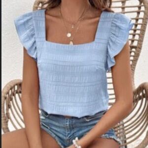 Light blue top